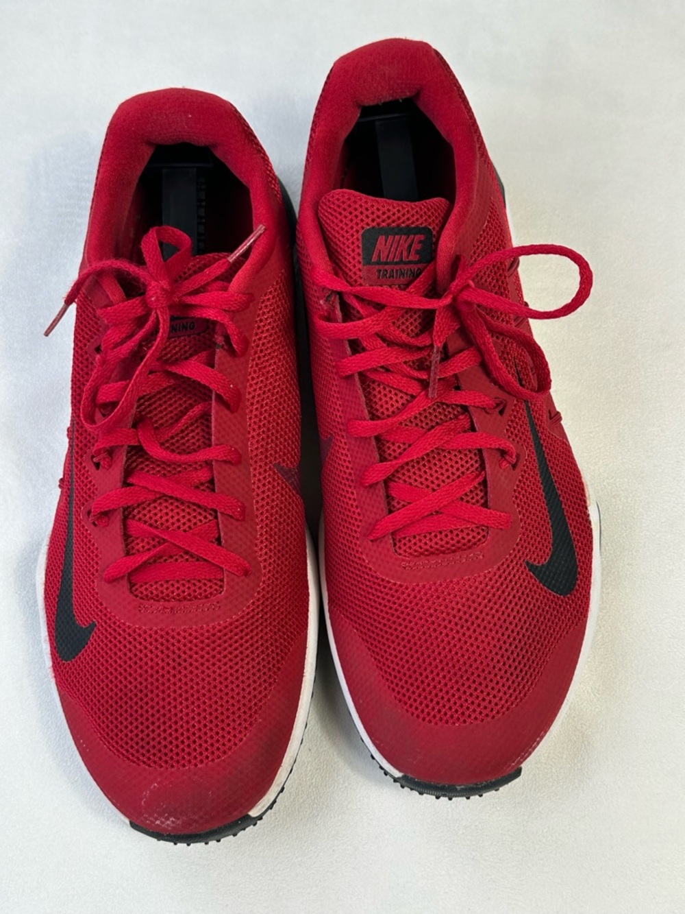 Nike Men’s Red Athletic Training Shoes with Black Swoosh